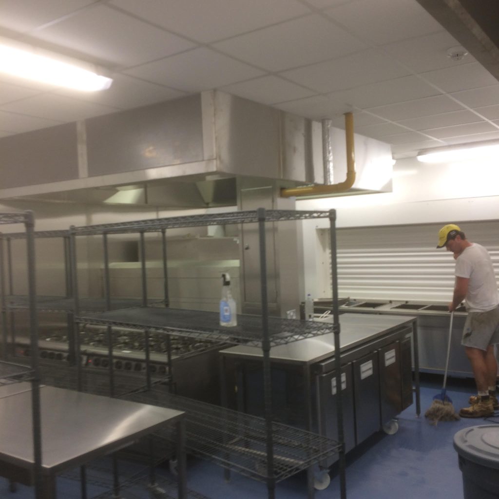 Commercial kitchen with wall cladding and flooring